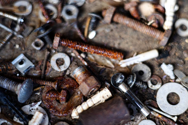 Dirty set of hand tools on a wooden panel.