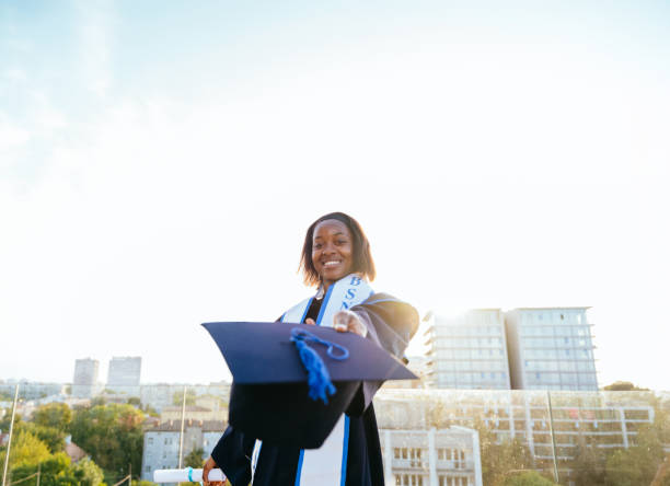 istock African female student graduate dressed in ceremonial robe. 2161750472