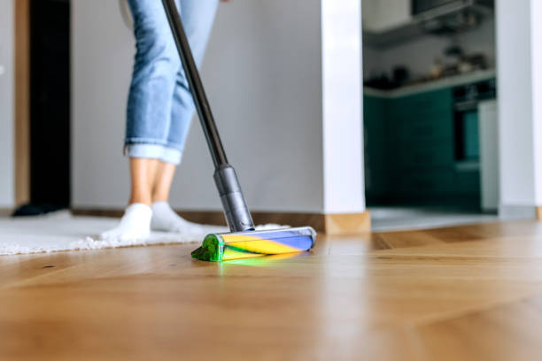 istock Unrecognisable woman using smart vacuum cleaner with dust scanner at home 2161752380