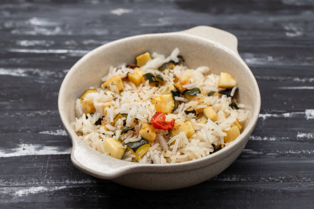 istock Boiled rice with vegetables in small bowl 2161752897