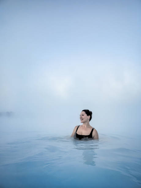 istock Woman Smiling in Hot Spring in Iceland 2161754262