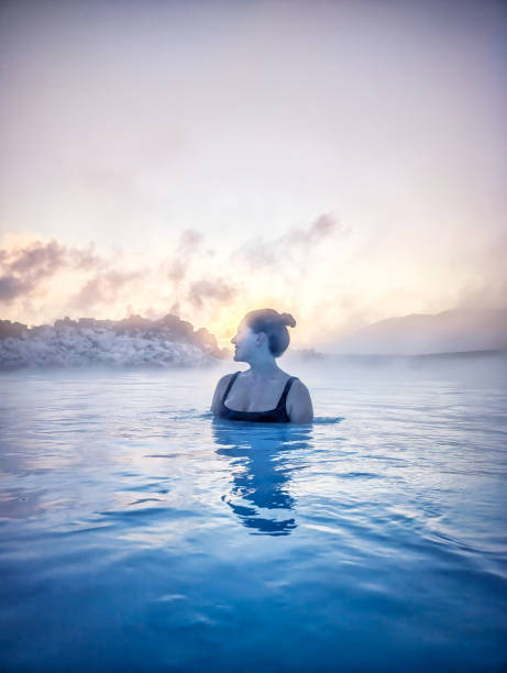 istock Woman Enjoying Misty Hot Spring in Iceland 2161754263
