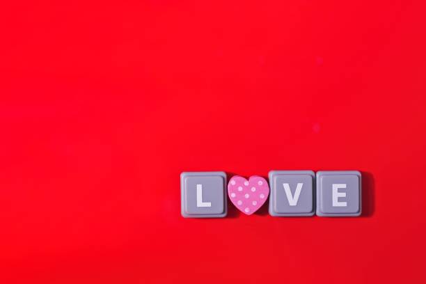istock Love - Stylised text on red background with copy space. 2161755119