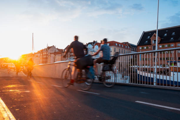 istock Cyclists on Bridge at Sunset in City 2161758326