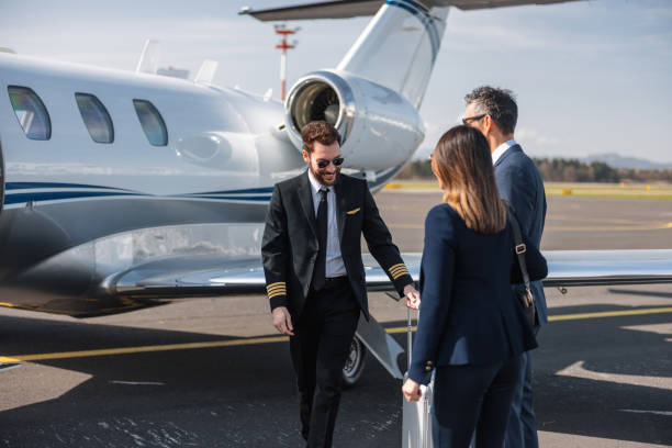 istock Asian Executives with Pilot Walking to Private Jet 2161758656