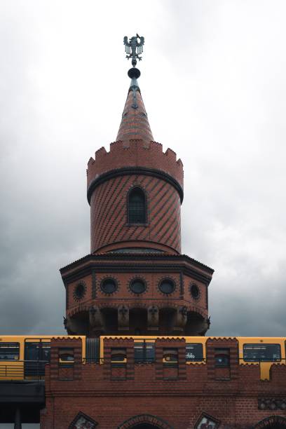 istock Historic Oberbaum Bridge tower with a yellow train passing in Berlin, Germany 2161763361