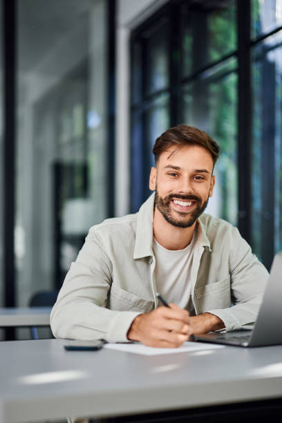 istock Portrait of a smiling man, working from the co-working space. 2161763814