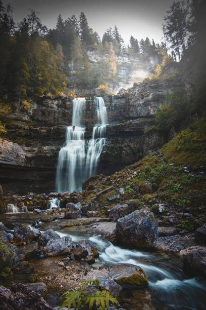 istock Enchanted waterfalls in a forest, Dolomites, Italy 2161763835
