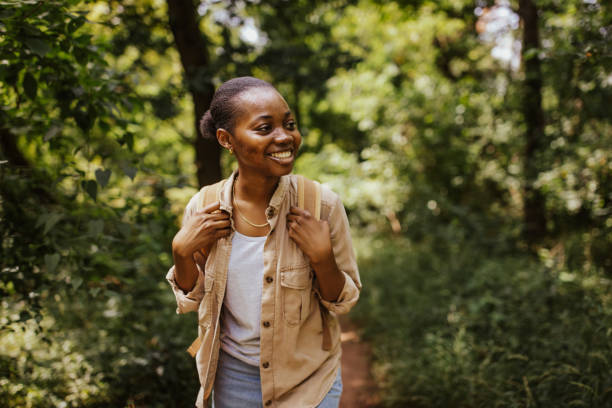 istock Happy hiker with backpack in the forest smiling big. 2161766526