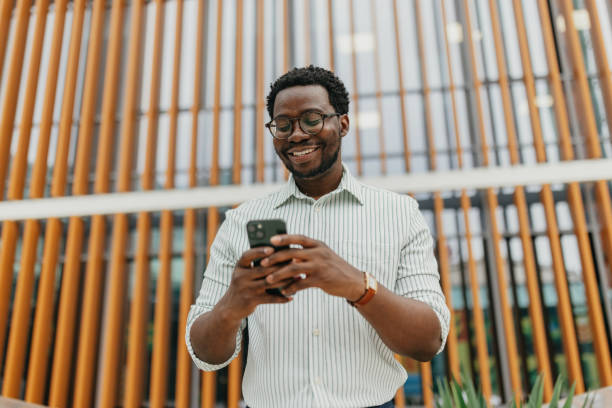 istock Man using smartphone in outdoor area with greenery 2161766664