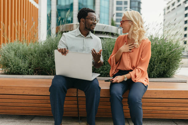 istock Two colleagues engaged in outdoor work on a laptop 2161766865
