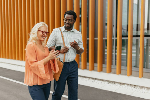 istock Business duo enjoying a walk outside modern office 2161767464
