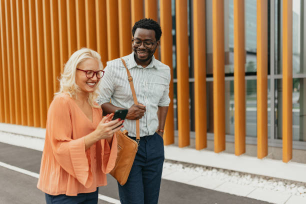 istock Colleagues walking and engaging outside urban office 2161767484
