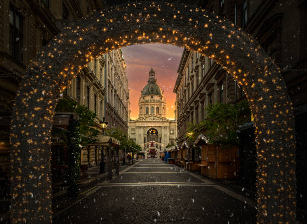 Christmas market at Saint Stephen Basilica in Budapest Christmas market at Saint Stephen Basilica in Budapest, with festive lights and holiday charm, Hungary hungary stock pictures, royalty-free photos & images