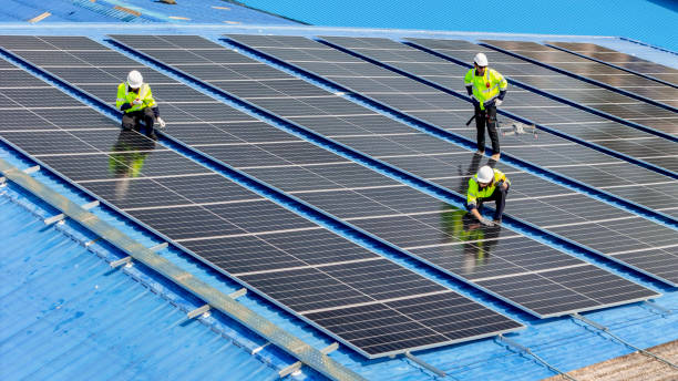 istock engineer man inspects construction of solar cell panel or photovoltaic cell by electronic device. Industrial Renewable energy of green power. factory worker working on tower roof. 2161773581