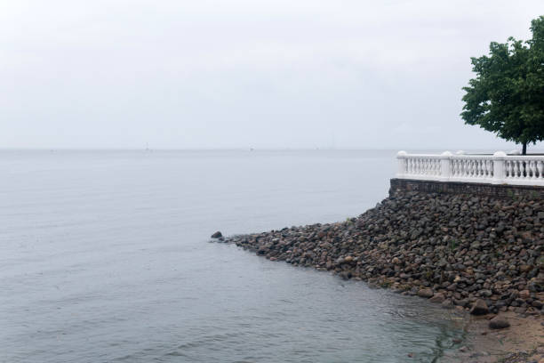 vintage white balustrade on a stone wall on the sea shore