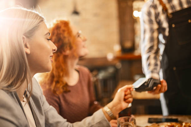 istock Friends Share Pizza and Conveniently Pay Bill with Credit Card 2161778695