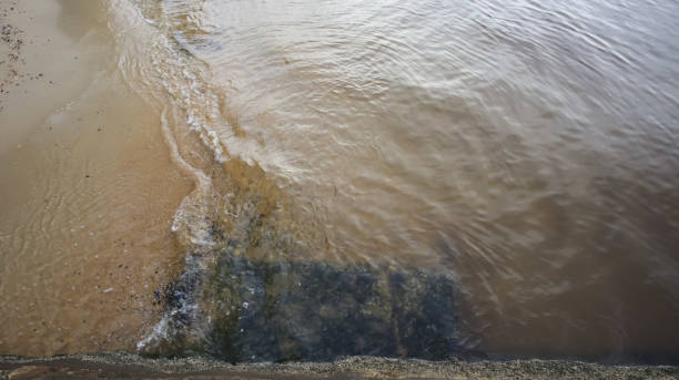 istock clear and gentle waves by the beach 2161780831