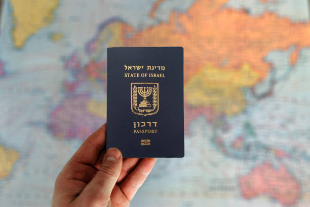 istock Israel passport in man hand 2161784170