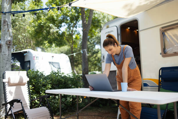 istock Young pregnant woman working online during camping 2161784681