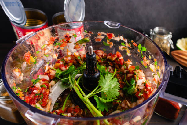istock Chunky Salsa in a Food Processor with Unblended Cilantro Sprigs 2161788444