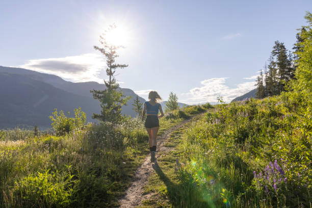 istock Young woman runs along pathway 2161789803
