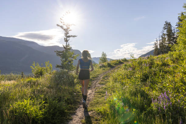 istock Young woman runs along pathway 2161789804