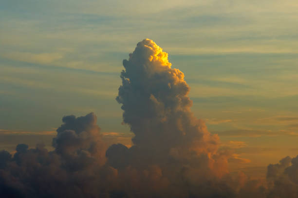 Sunset sky with bright colorful orange and yellow clouds. Panoramic skyscape.