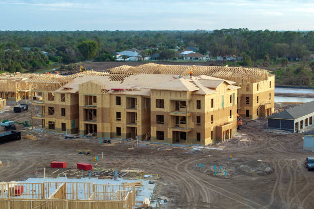 istock Wooden apartment buildings under construction in new developing suburban area. Development of residential housing in Florida suburbs. Real estate market in the USA 2161790543