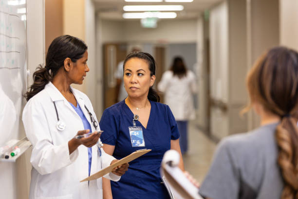 istock Female doctor explains protocol to mature female nurse 2161790783