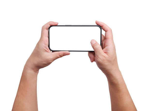 istock Hand is holding a smartphone in horizontal with a thumb touch on screen isolated in white background. Concept of modern technology and communication. 2161792495