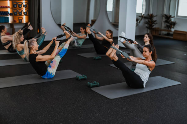 istock Teamwork During Group Workout Class With Pilates Rings For Females 2161798998