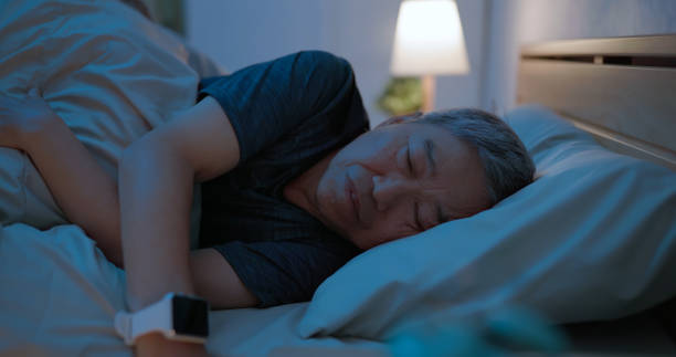istock old man sleep with smartwatch 2161799400