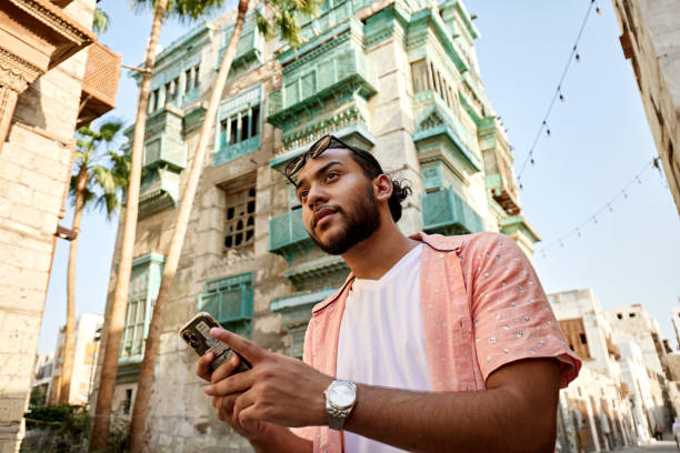 istock Thoughtful young Saudi man with smart phone 2161801493
