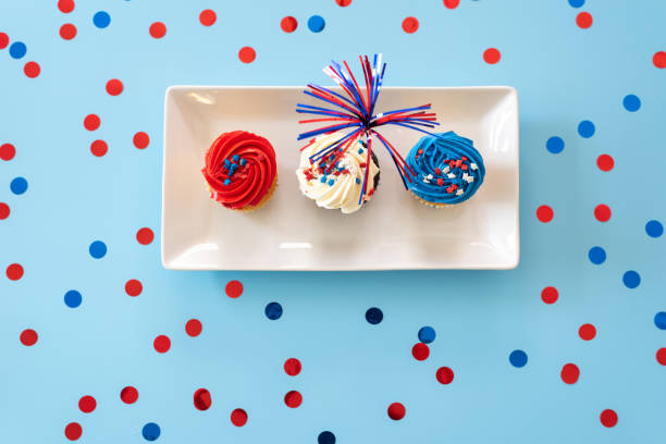 istock Red white and blue cupcake flat lay with confetti 2161801508