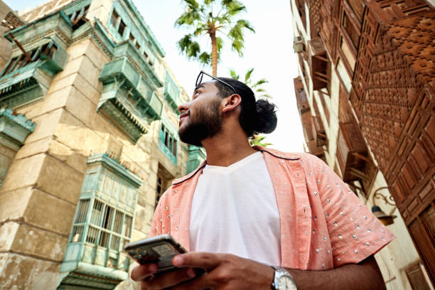 istock Young Saudi man looking at buildings in Al-Balad district 2161801713