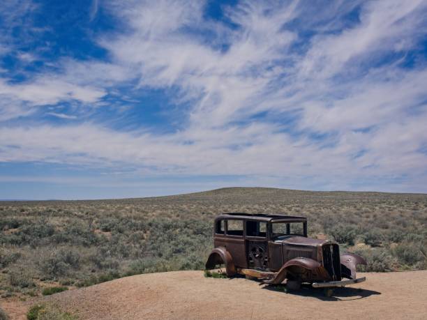 Vintage automobile in painted desert. Along old route 66 near the entrance to the Petrified Forest national park.