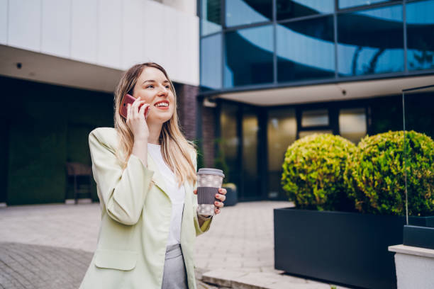 istock Business woman taking on the phone and going to work 2161804902
