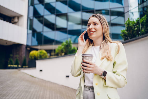 istock Business woman taking on the phone and going to work 2161804916