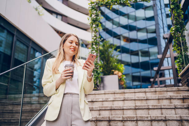 istock Business woman using phone and going to work 2161805561