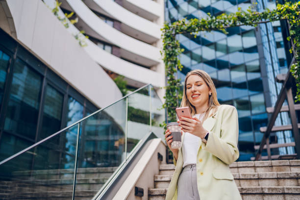istock Business woman using phone and going to work 2161805571