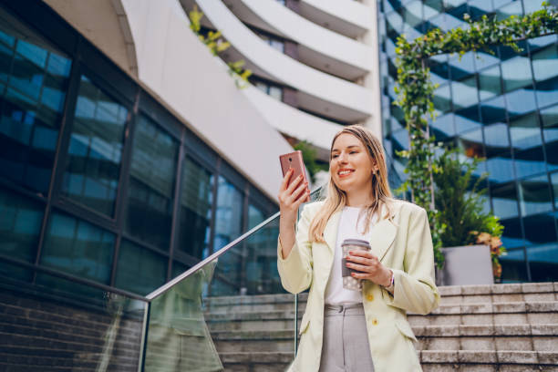 istock Business woman using phone and going to work 2161805641