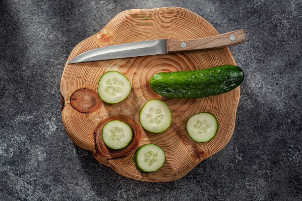 Chopped Cucumber With Kitchen Knife .On Cuttin Board