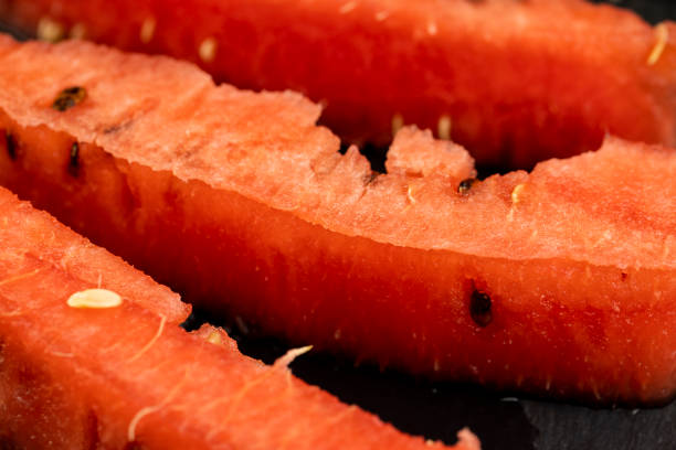 pieces of red watermelon on the table, cooking ripe red watermelon
