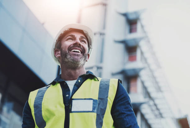 istock Man, construction and architecture thinking outside, building vision and plan or property development. Professional, inspection and happy architect in city, engineering design and employee or idea 2161812774