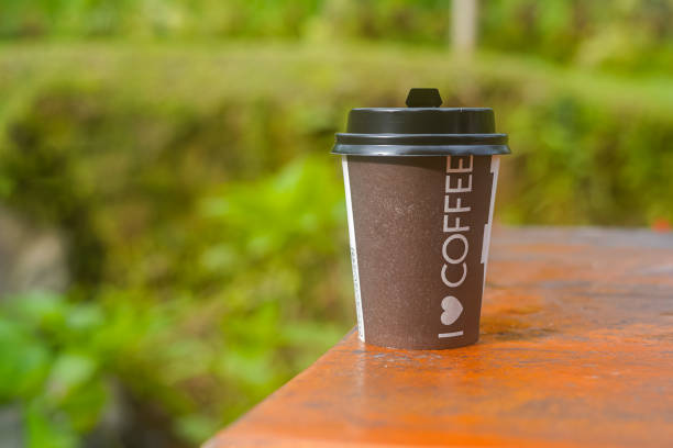 coffee takeaway on the table - bokeh background - 3d illustration rendering