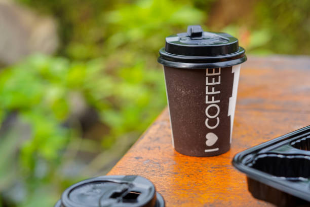 istock Paper cup of coffee on wooden table background 2161816568