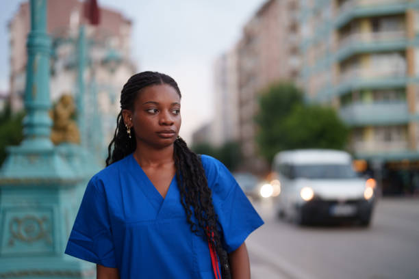 istock Healthcare worker walking next to road after work. 2161821366
