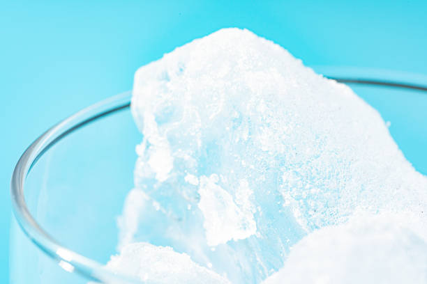 istock Glass with ice on light blue background 2161822226