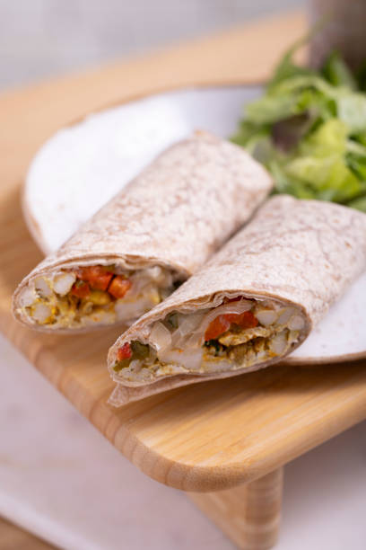 istock Grilled chicken wrap with bell peppers and onion 2161825734